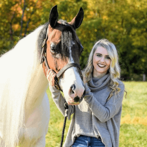 smiling woman with horse